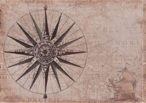 a map with a compass rose and a sailing ship