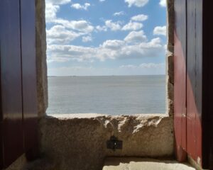 view from an open window across the sea